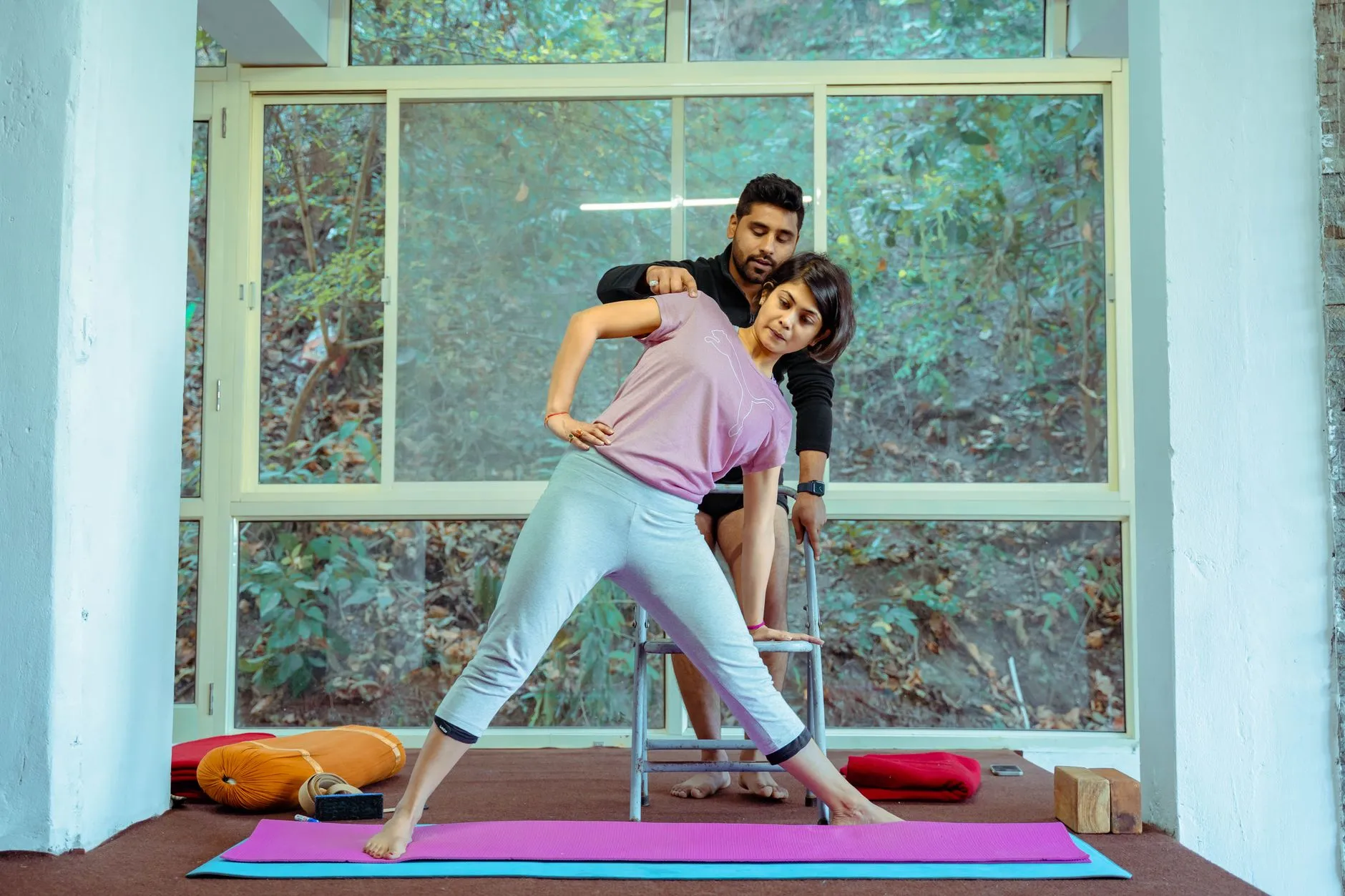 Framing Yoga Poses Yoga teacher framing poses during training