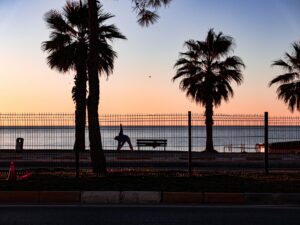 Serene sunrise at a beach yoga session