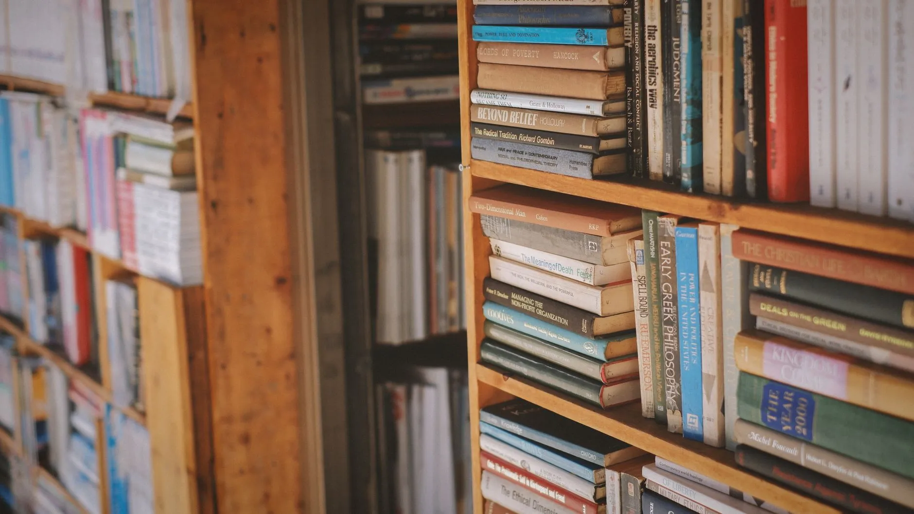 Books on yoga philosophy stacked on a table