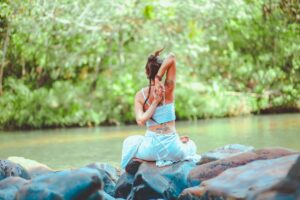 Yoga meditation session held in lush green surroundings