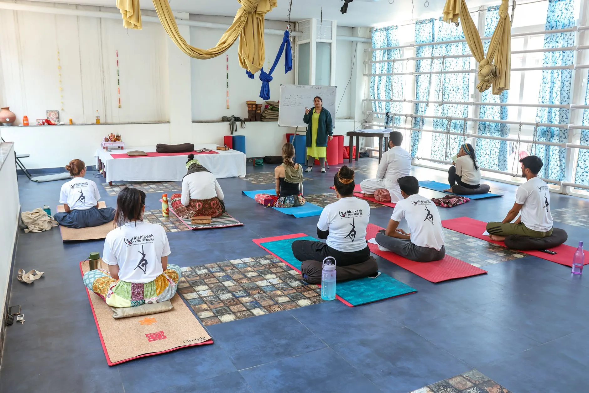 yoga instructor teaching a class