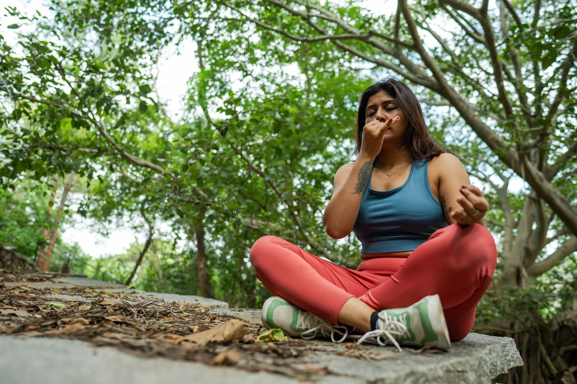 Person practicing deep breathing outdoors
