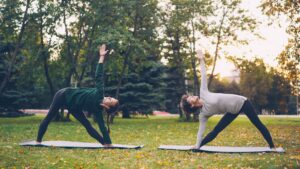 Practicing yoga in a serene outdoor setting.
