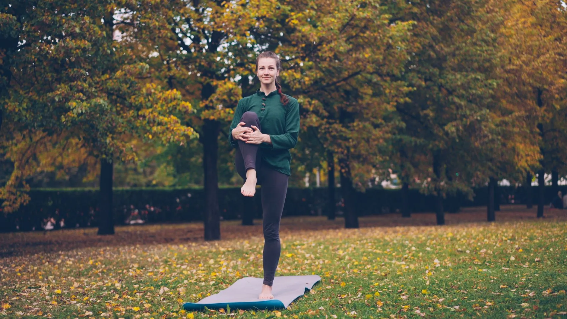 Yoga stretching outdoors in a calm environment