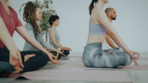 Close-up of students practicing Alchemy Yoga elements